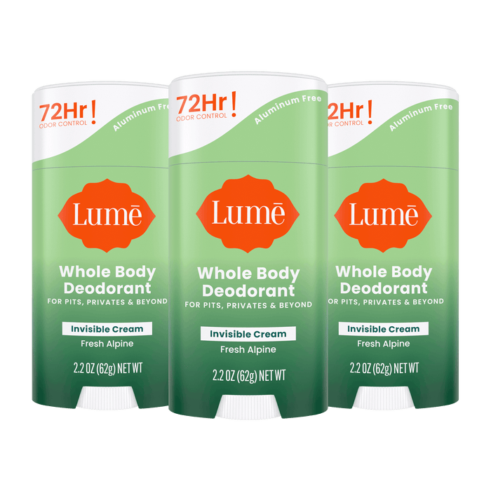 Three green Lume cream deodorant sticks in the scent Fresh Alpine