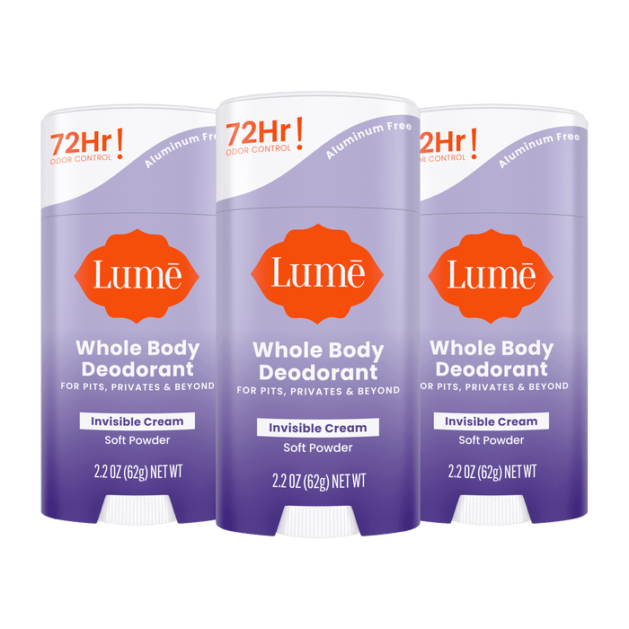Three purple Lume cream deodorant sticks in the scent Soft Powder